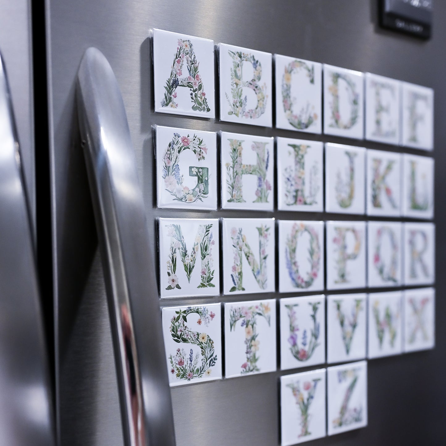 Alphabet magnets on a refrigerator door
