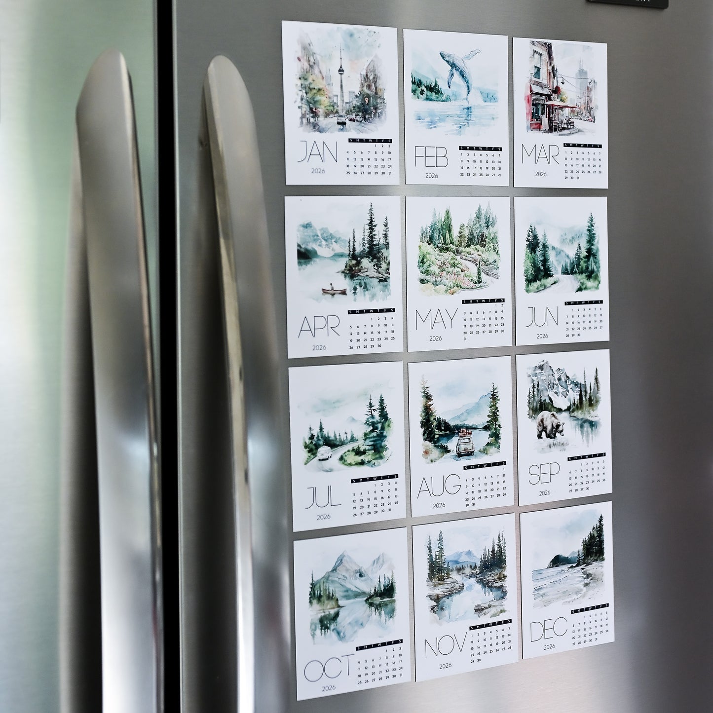 Custom Photo Magnet Calendar with scenic designs attached to a refrigerator door