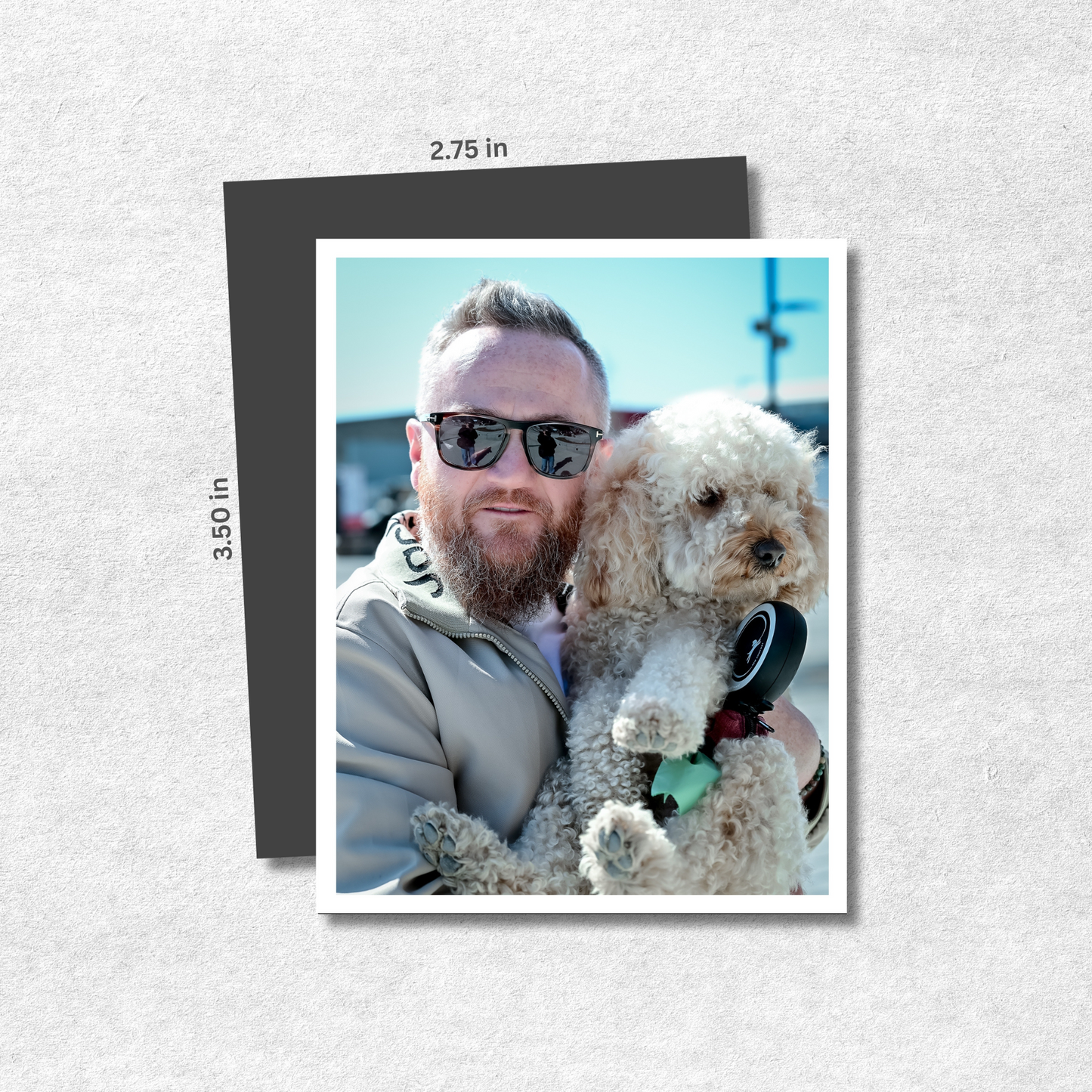 Man holding a dog with sunglasses on, displayed on a photo magnet with dimensions indicated.