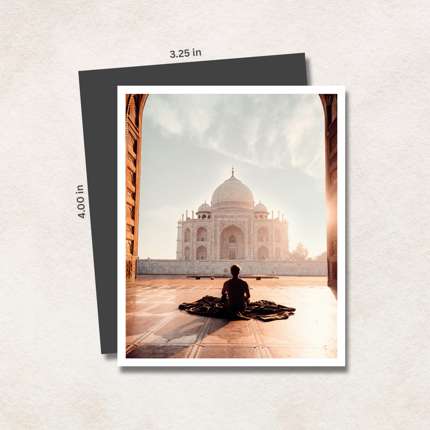 Photo magnet with a person sitting in front of the Taj Mahal, with dimensions indicated.