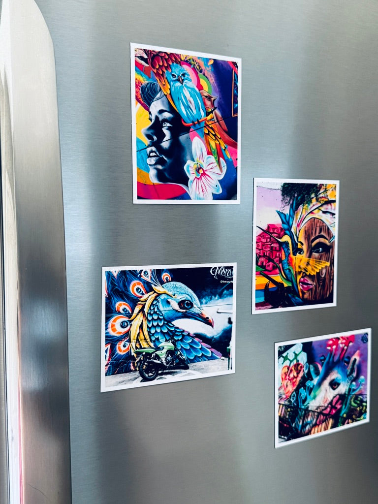 Colorful artwork  photo magnets on a refrigerator